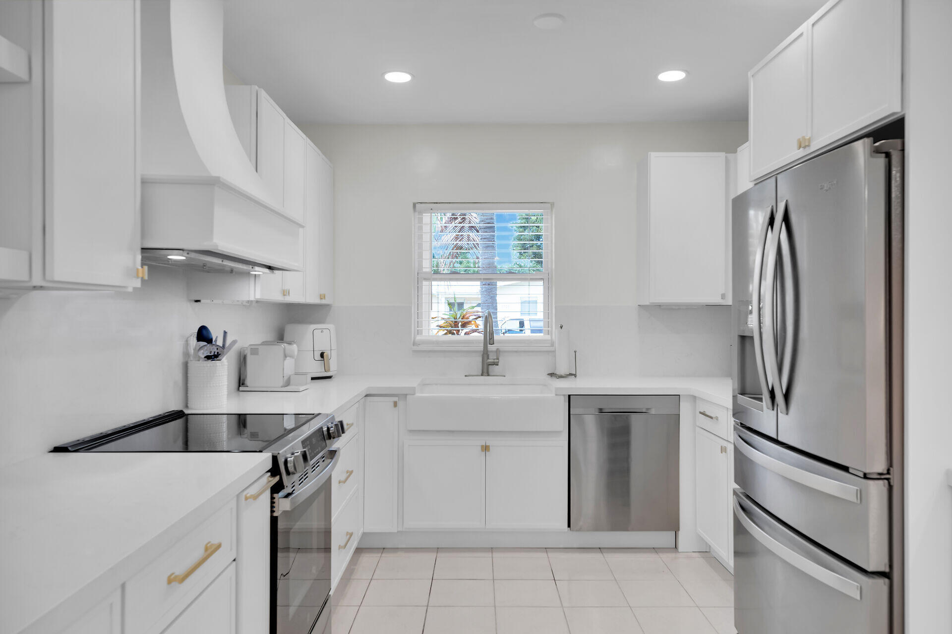 3722 Cindy Avenue Key West, FL 33040 - Photo 12 of 38 a kitchen with a sink stainless steel appliances and cabinets