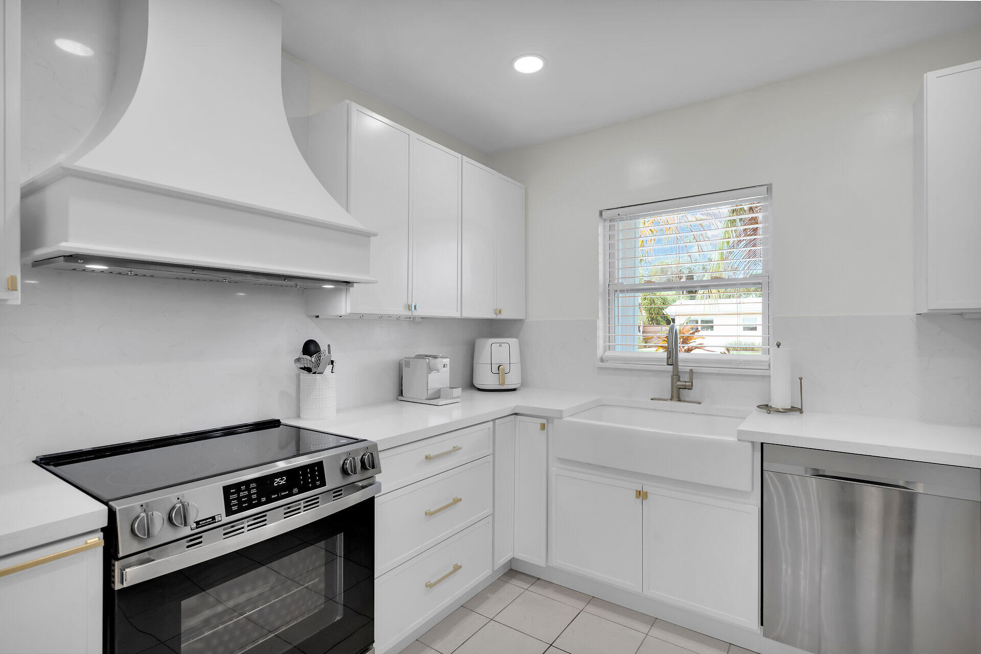 3722 Cindy Avenue Key West, FL 33040 - Photo 13 of 38 a kitchen with a stove sink and cabinets