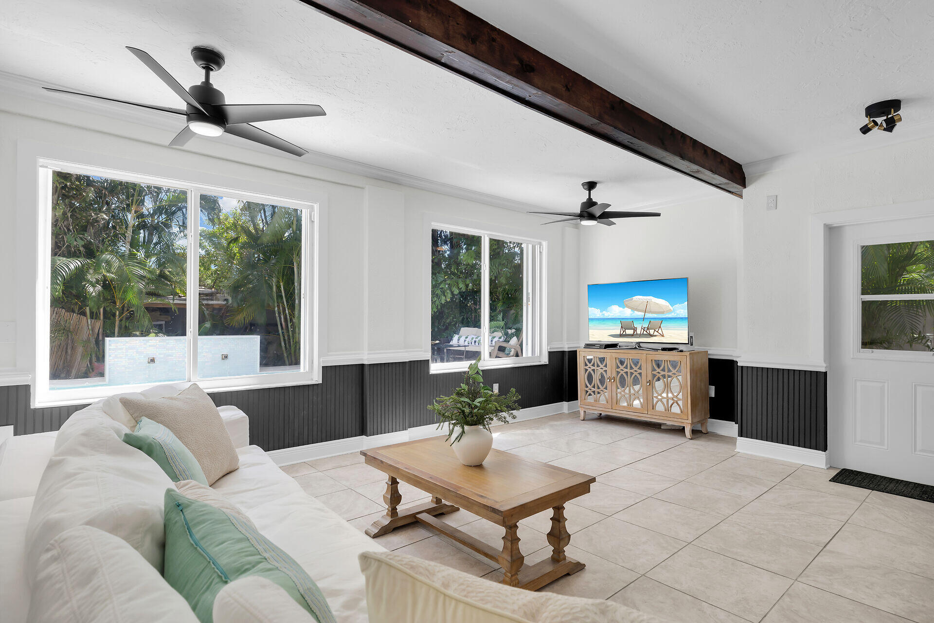 3722 Cindy Avenue Key West, FL 33040 - Photo 15 of 38 a living room with furniture a large window and a flat screen tv