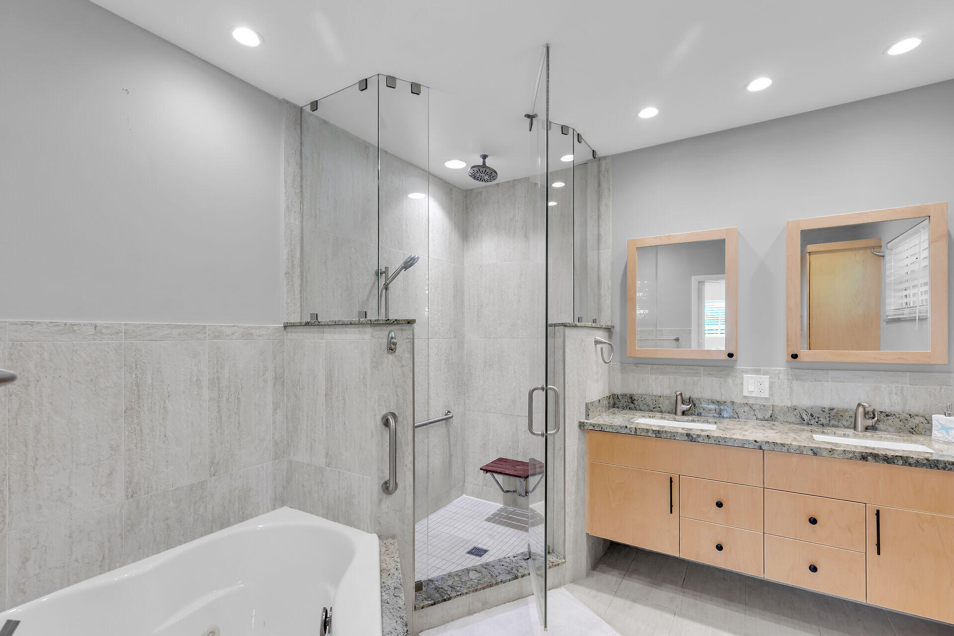 3722 Cindy Avenue Key West, FL 33040 - Photo 25 of 38 a bathroom with a granite countertop sink a mirror a bathtub and shower