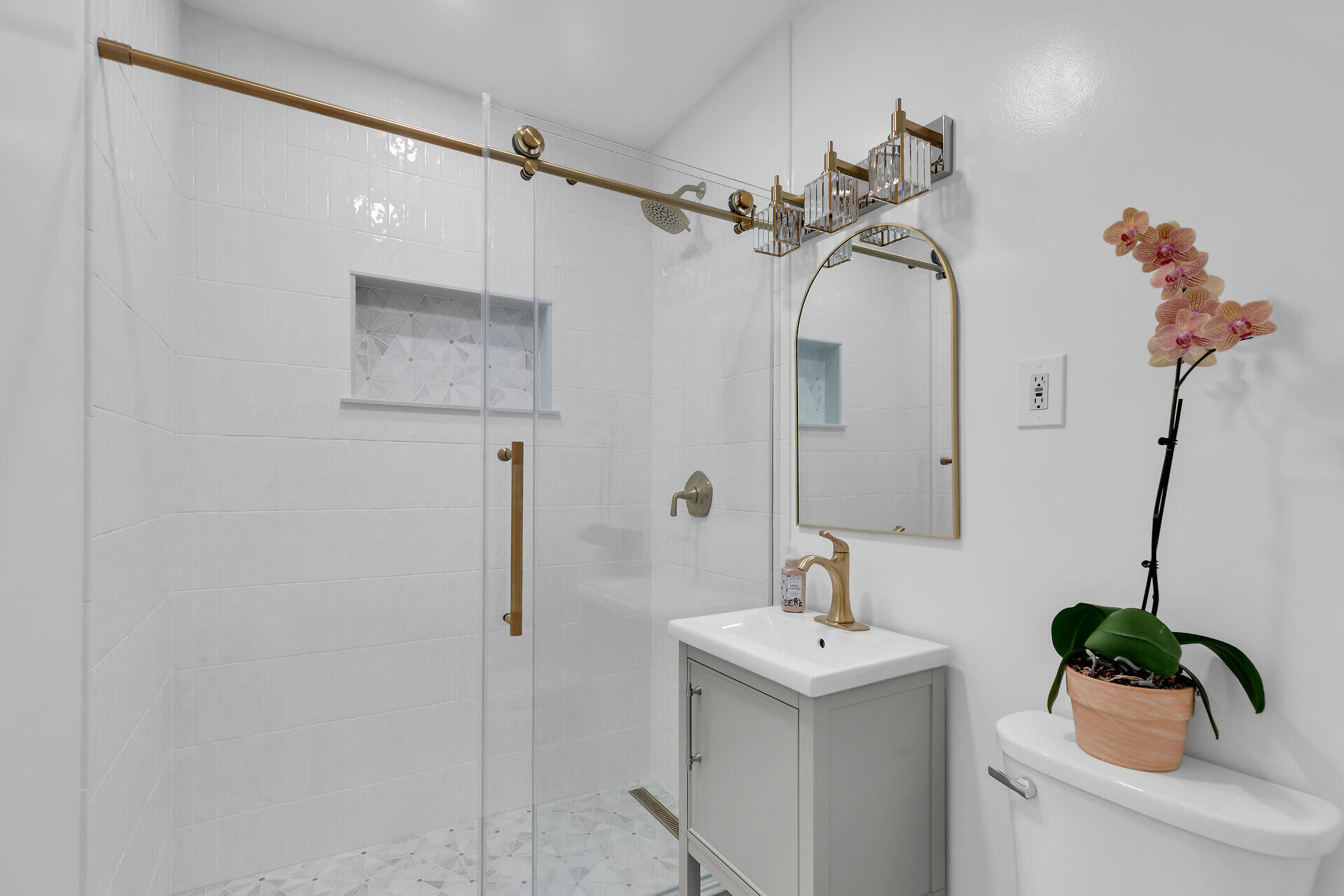 3722 Cindy Avenue Key West, FL 33040 - Photo 28 of 38 a bathroom with a sink and mirror with bathtub