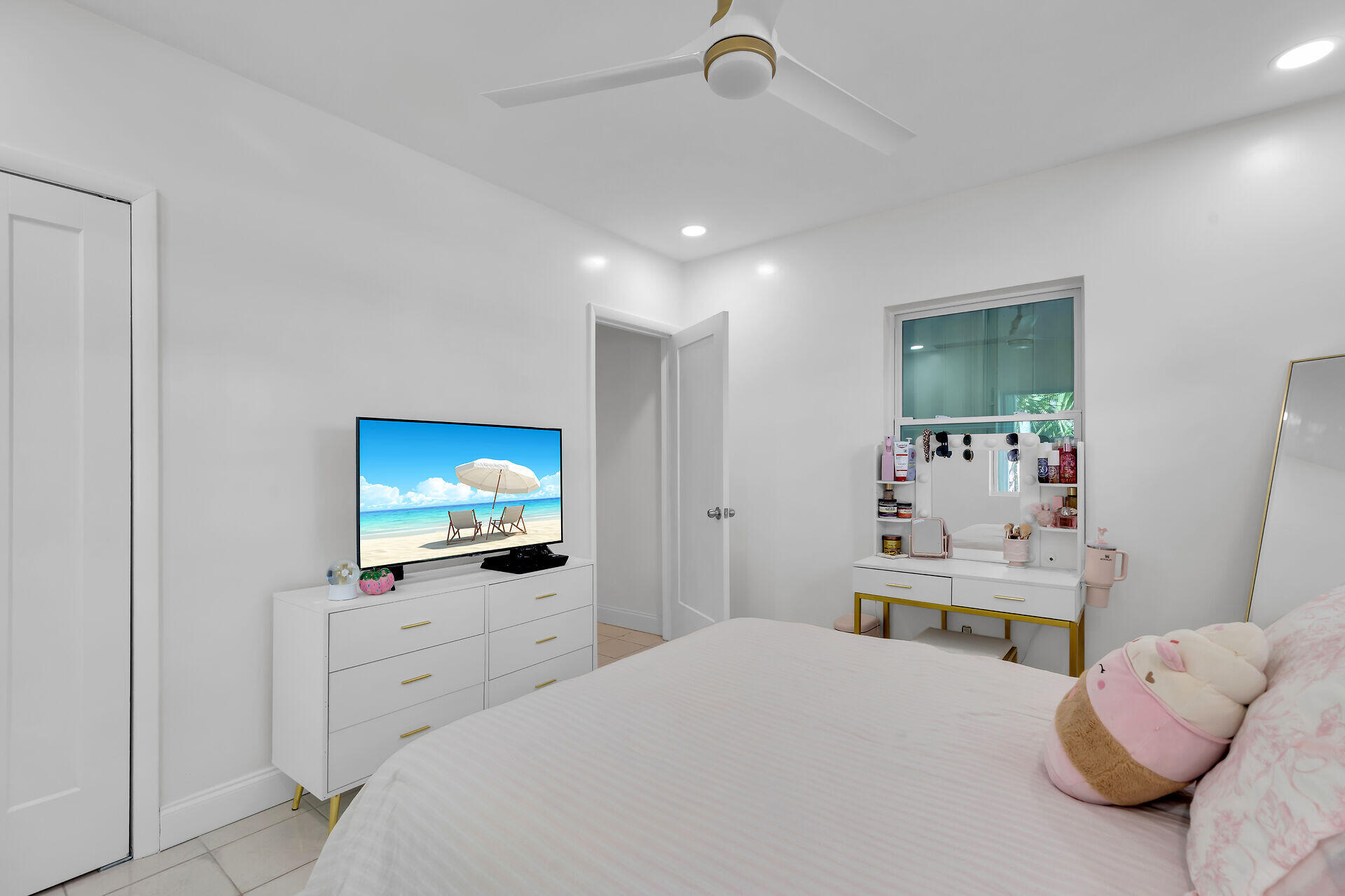 3722 Cindy Avenue Key West, FL 33040 - Photo 33 of 38 a bedroom with furniture and a flat screen tv