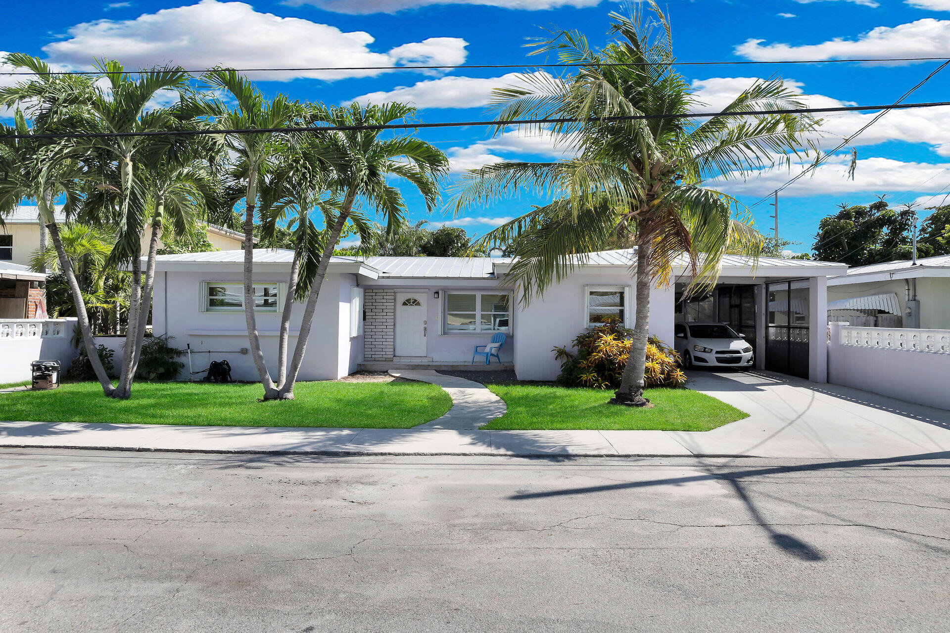 3722 Cindy Avenue Key West, FL 33040 - Photo 35 of 38 a front view of a house with a yard and potted plants