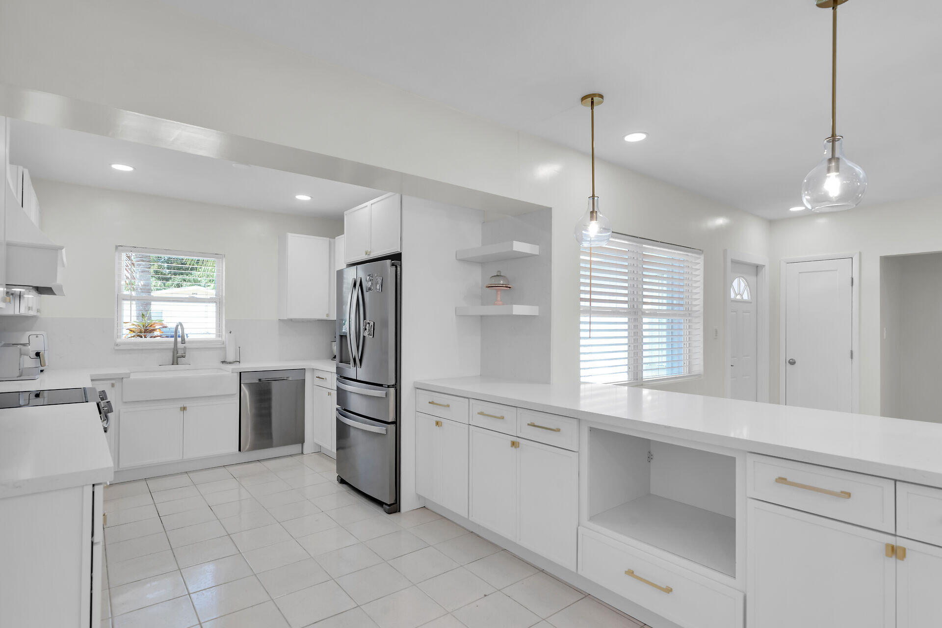 3722 Cindy Avenue Key West, FL 33040 - Photo 10 of 38 a kitchen with white cabinets and window