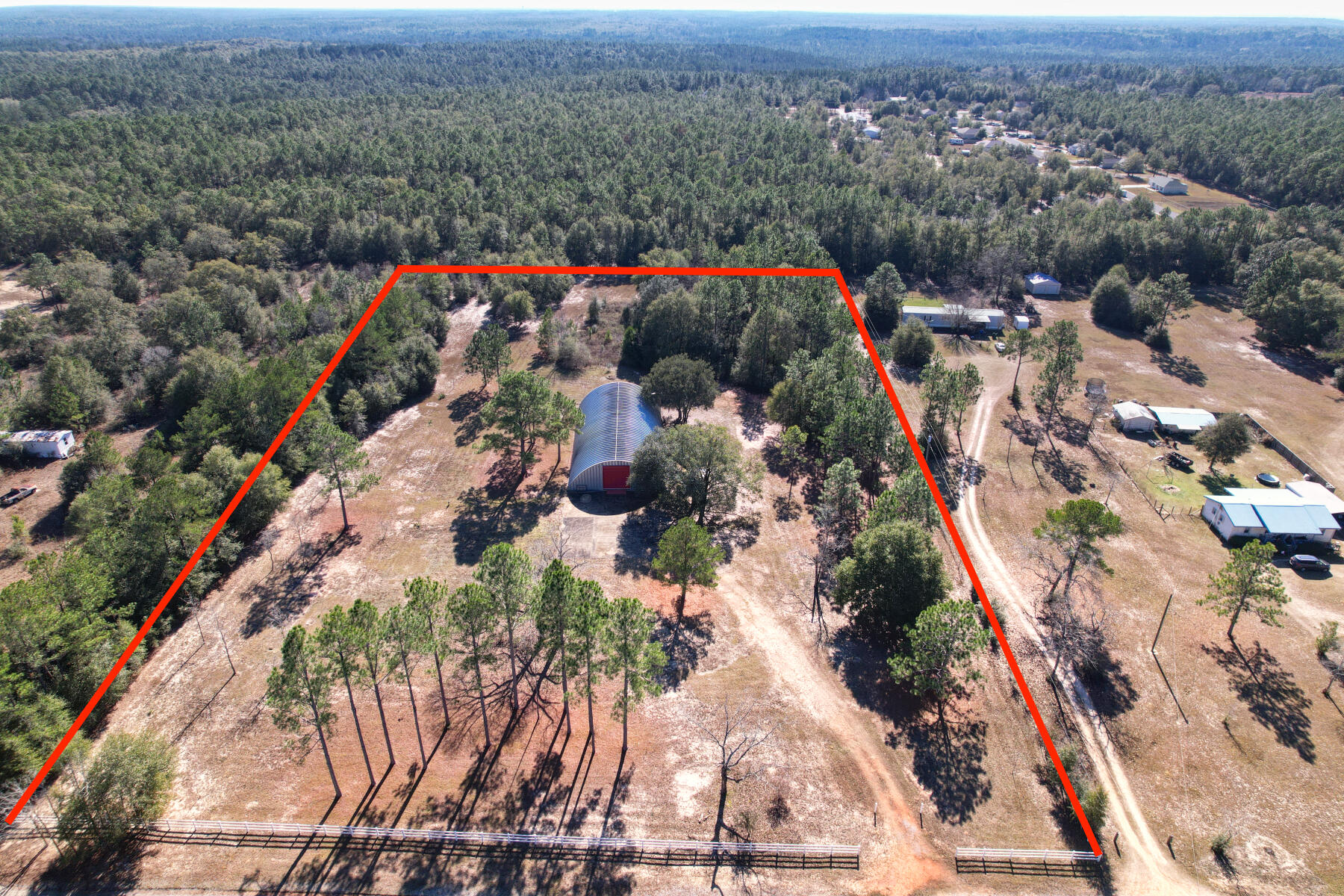 an aerial view of a houses with a yard