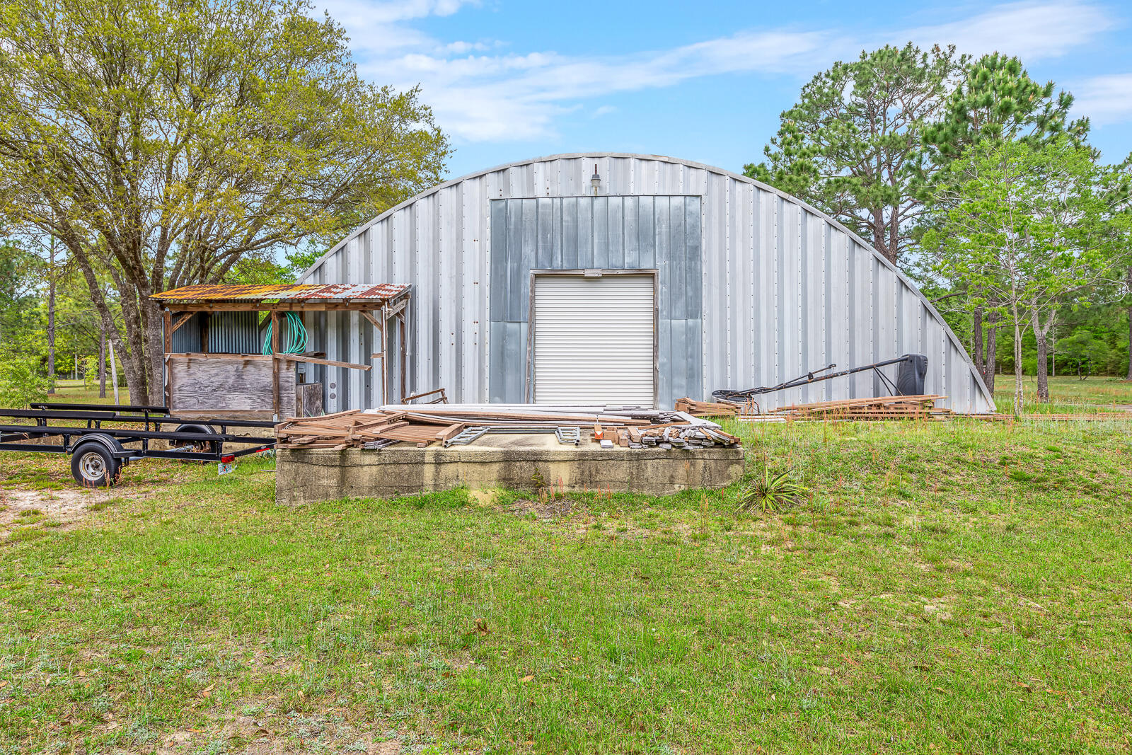 4156 Painter Branch Road Crestview, FL 32539 - Photo 19 of 23 a view of a house with swimming pool and sitting area