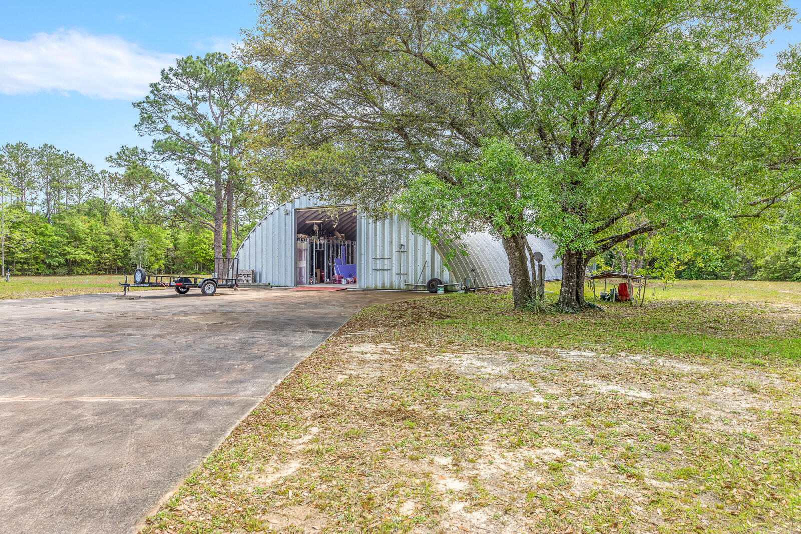 4156 Painter Branch Road Crestview, FL 32539 - Photo 20 of 23 a view of a yard with plants and trees