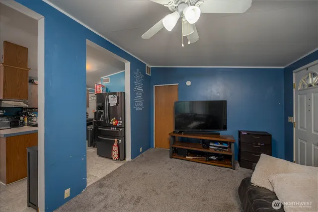 a view of livingroom with furniture and a flat screen tv