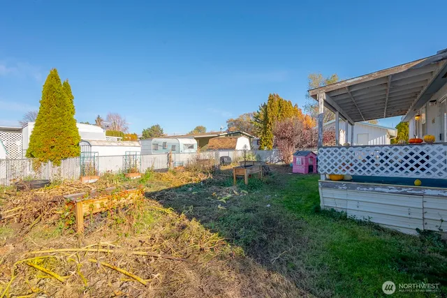 a view of a house with a snow in the background