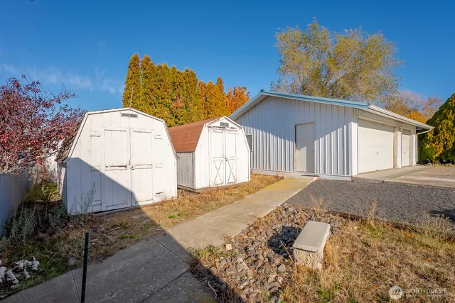 a view of a house with a yard and garage