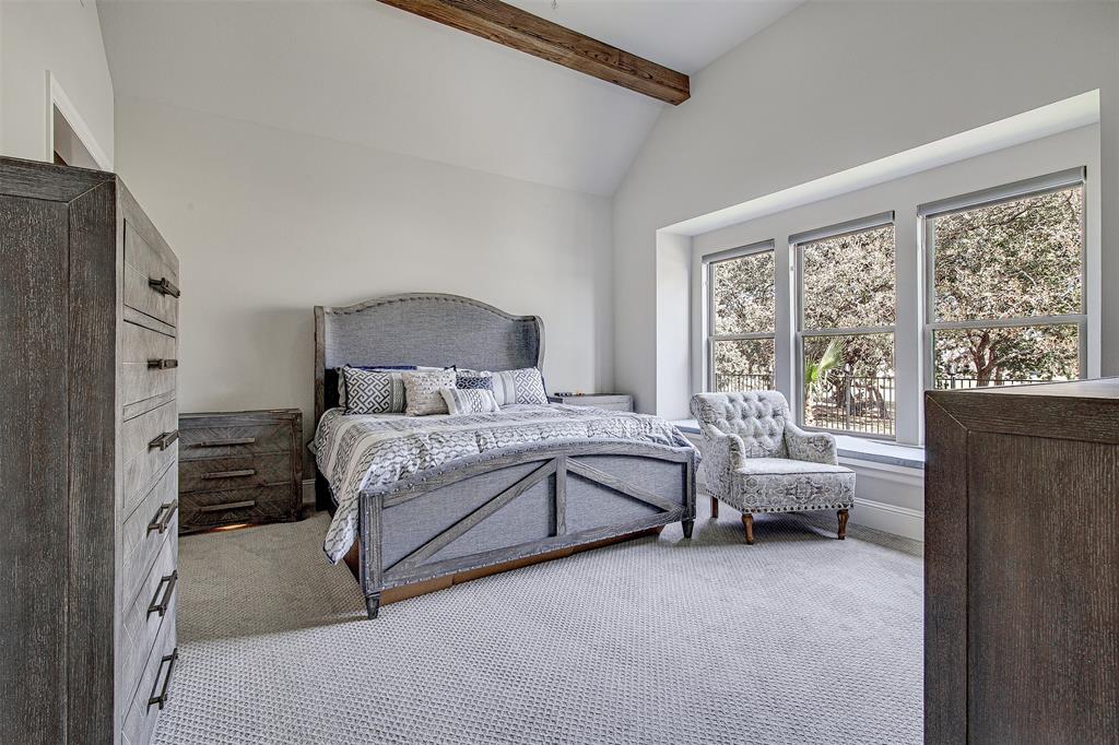 13924 East Riviera Drive Fort Worth, TX 76028 - Photo 17 of 38 a bedroom with a bed and a large window