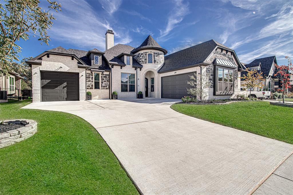13924 East Riviera Drive Fort Worth, TX 76028 - Photo 2 of 38 a view of a big house with a big yard and large tree