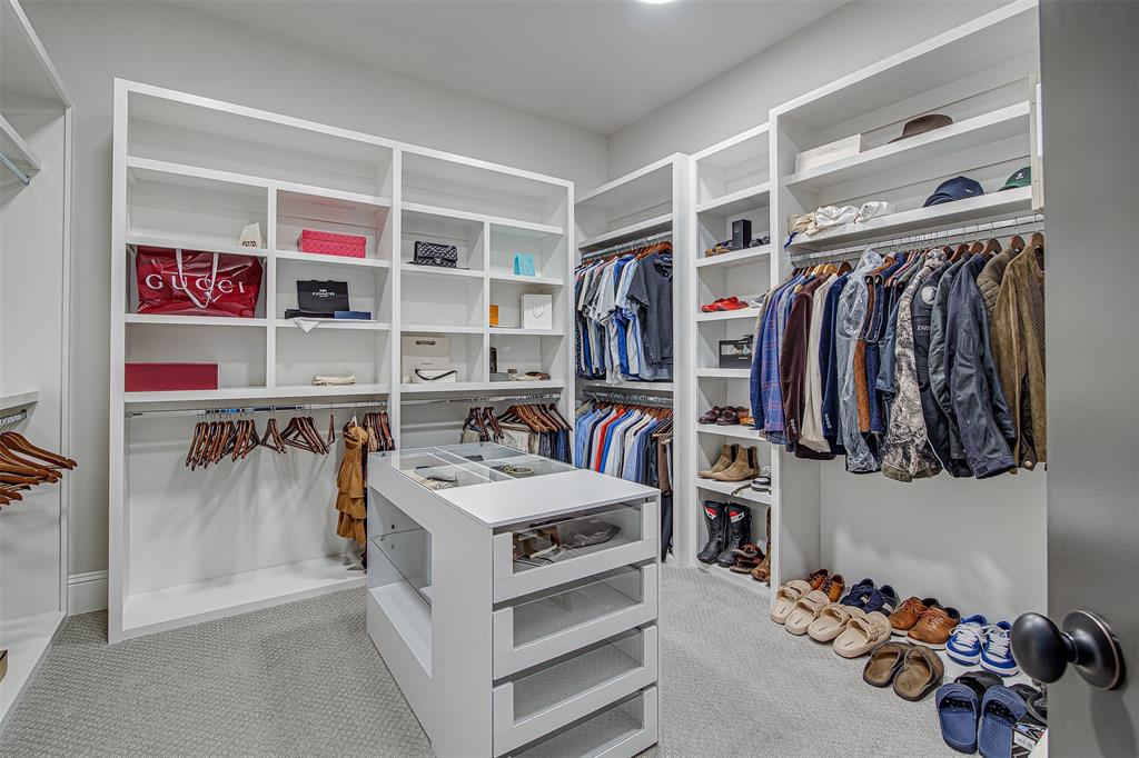 13924 East Riviera Drive Fort Worth, TX 76028 - Photo 23 of 38 a view of walk in closet with clothes and shoes