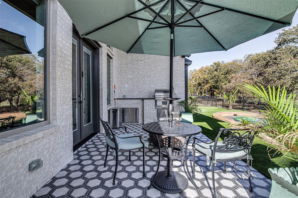 13924 East Riviera Drive Fort Worth, TX 76028 - Photo 32 of 38 a view of an outdoor sitting area with furniture