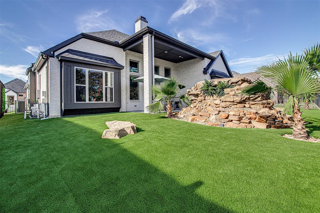 13924 East Riviera Drive Fort Worth, TX 76028 - Photo 35 of 38 a front view of a house with garden