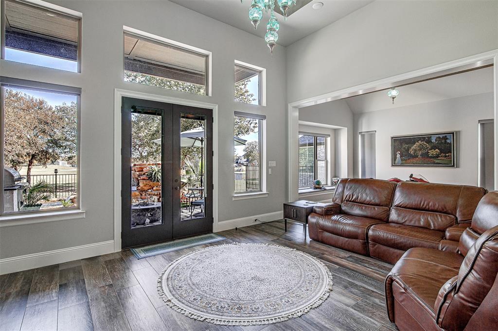 13924 East Riviera Drive Fort Worth, TX 76028 - Photo 6 of 38 a living room with furniture and a large window