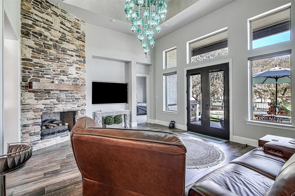 13924 East Riviera Drive Fort Worth, TX 76028 - Photo 7 of 38 a living room with furniture and a flat screen tv