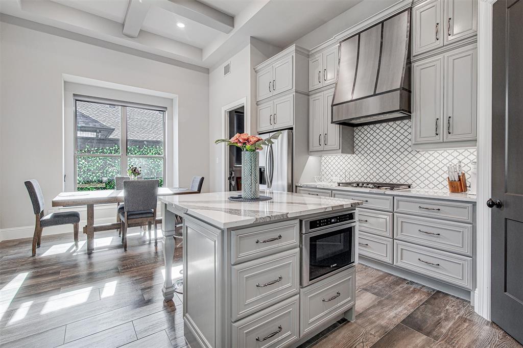 13924 East Riviera Drive Fort Worth, TX 76028 - Photo 10 of 38 a kitchen with stainless steel appliances granite countertop a stove a sink and a refrigerator
