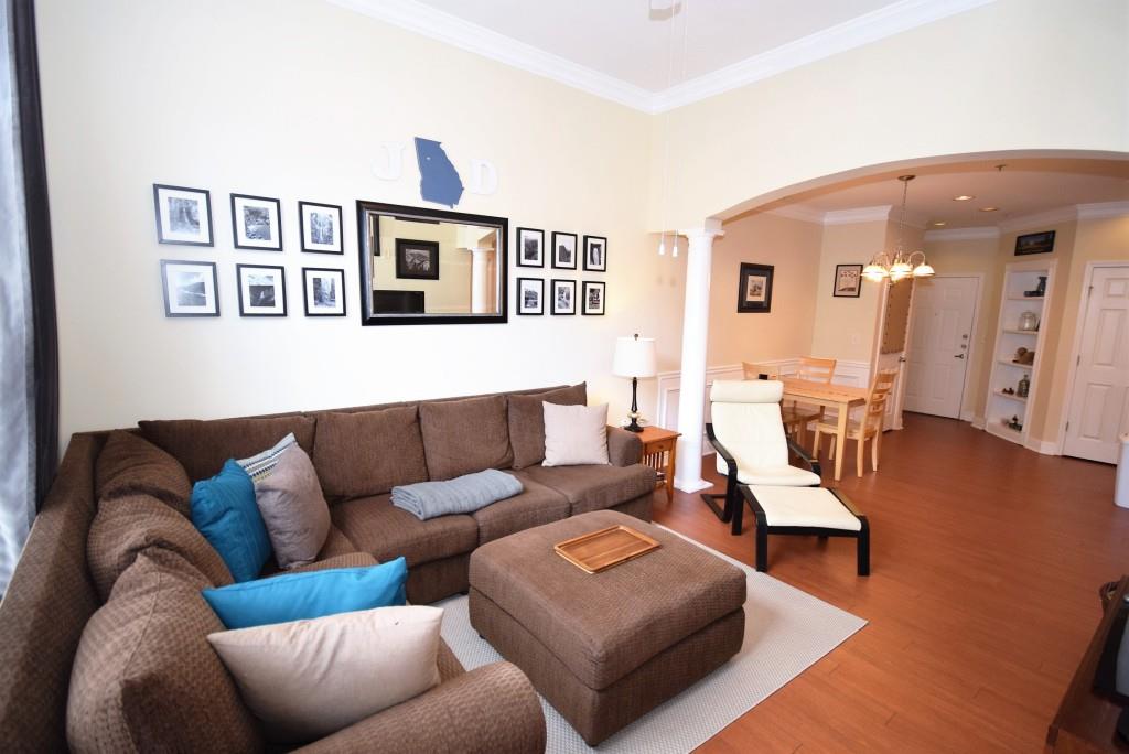 Top floor condo unit boast open floor plan accented with traditional elements and gleaming wood floors.