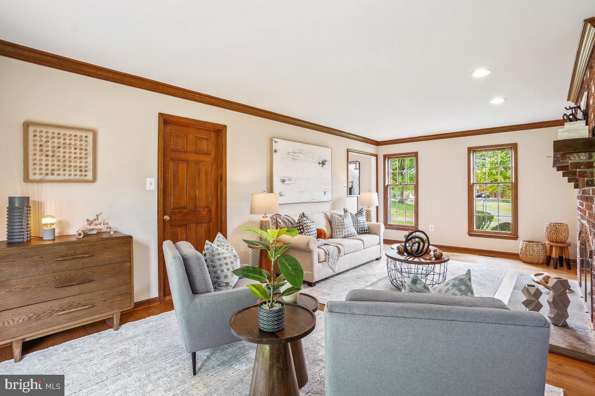 121 Farmgate Lane Silver Spring, MD 20905 - Photo 11 of 51 a living room with furniture and large windows