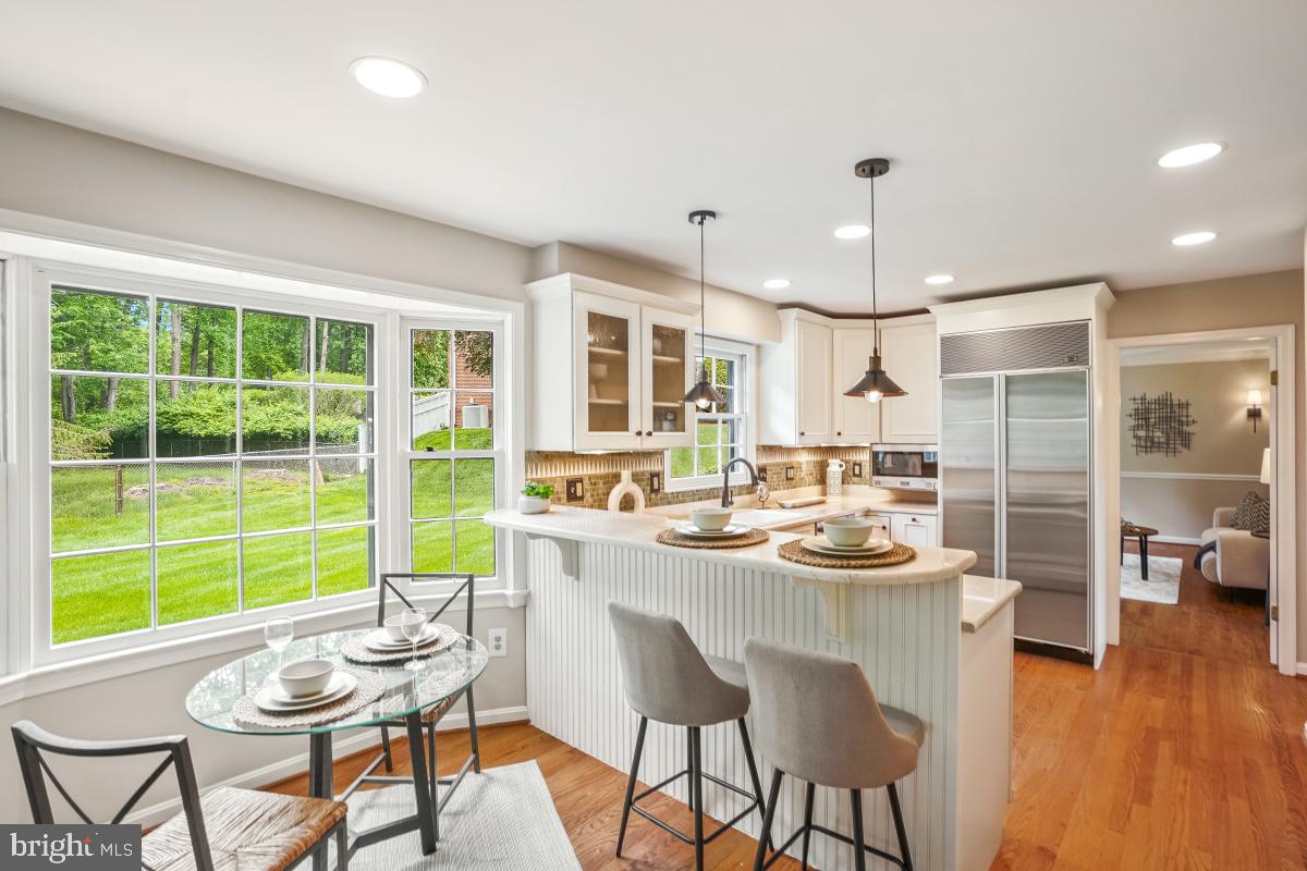 121 Farmgate Lane Silver Spring, MD 20905 - Photo 17 of 51 a kitchen with a table and chairs