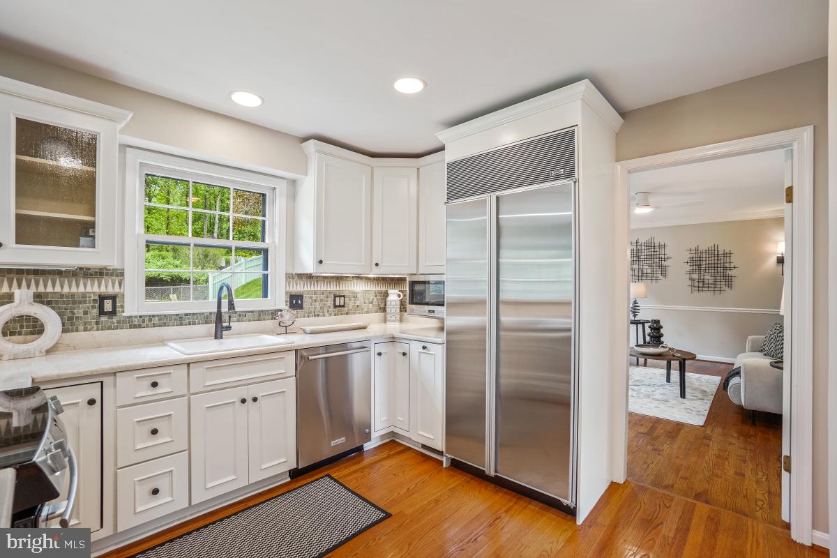 121 Farmgate Lane Silver Spring, MD 20905 - Photo 20 of 51 a kitchen with a refrigerator and a sink