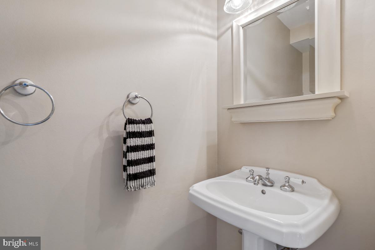 121 Farmgate Lane Silver Spring, MD 20905 - Photo 25 of 51 a bathroom with a sink and a mirror