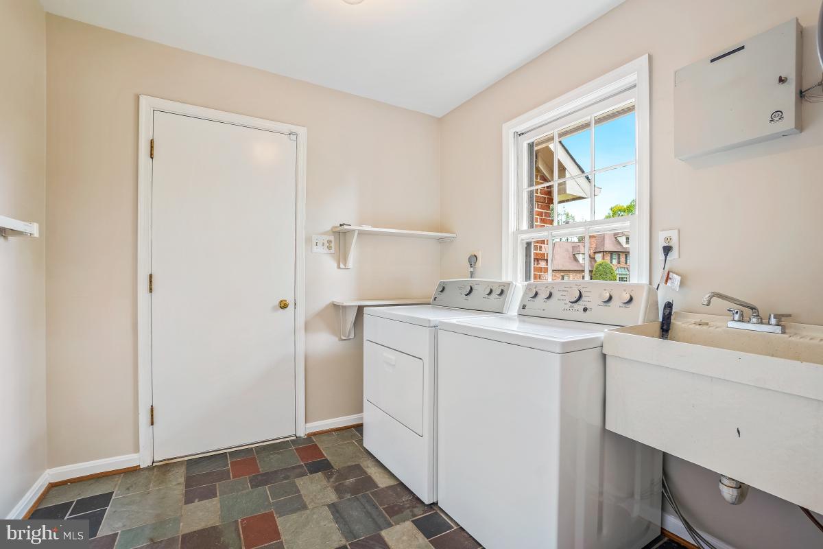 121 Farmgate Lane Silver Spring, MD 20905 - Photo 26 of 51 a room with a sink a mirror and cabinets