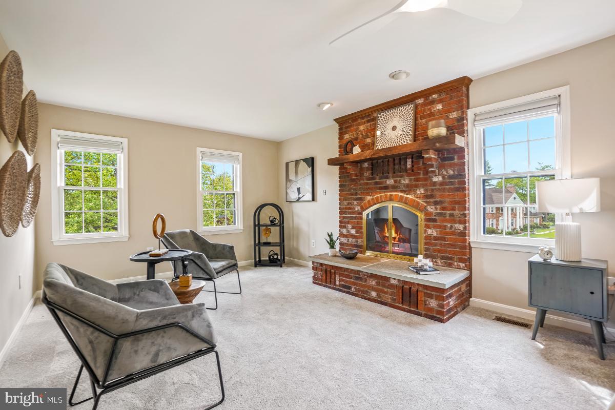 121 Farmgate Lane Silver Spring, MD 20905 - Photo 29 of 51 a living room with furniture and a fireplace
