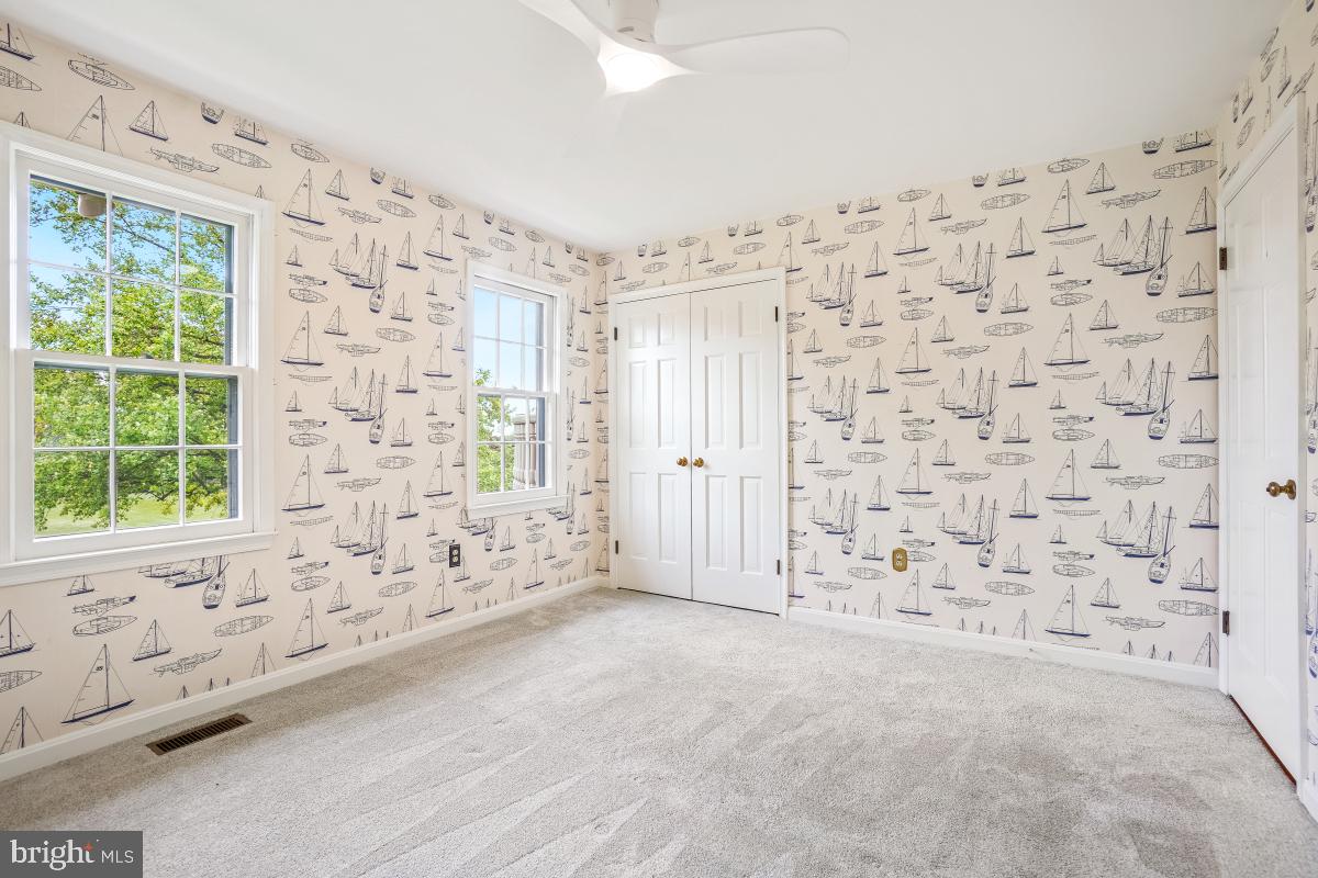 121 Farmgate Lane Silver Spring, MD 20905 - Photo 37 of 51 a view of an empty room with a window