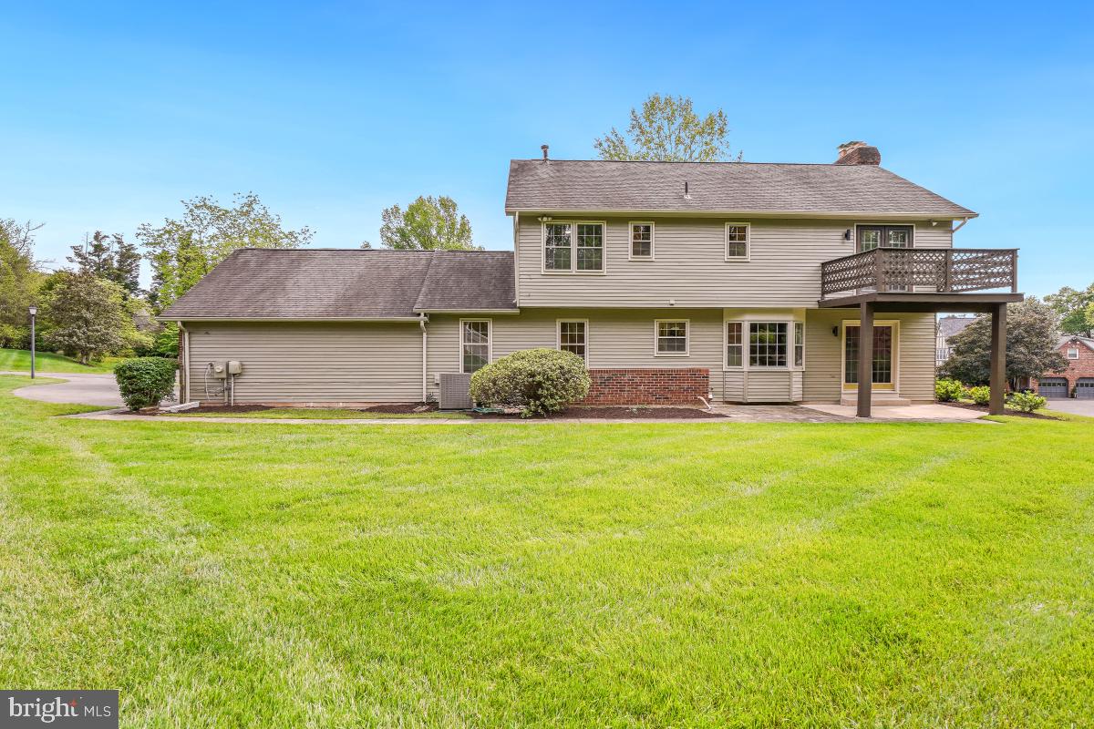 121 Farmgate Lane Silver Spring, MD 20905 - Photo 47 of 51 a front view of a house with a garden