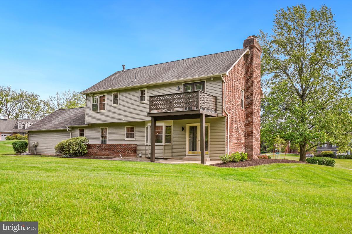 121 Farmgate Lane Silver Spring, MD 20905 - Photo 48 of 51 a front view of a house with a garden