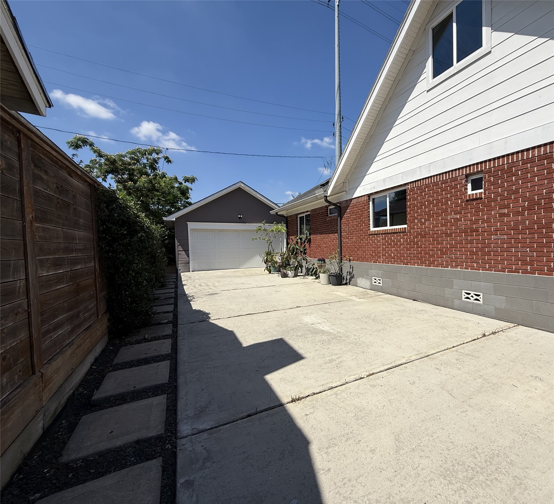 2302 Ruth Street Houston, TX 77004 - Photo 17 of 18 Beyond a gate, a long/wide driveway leads to the 2-car garage.