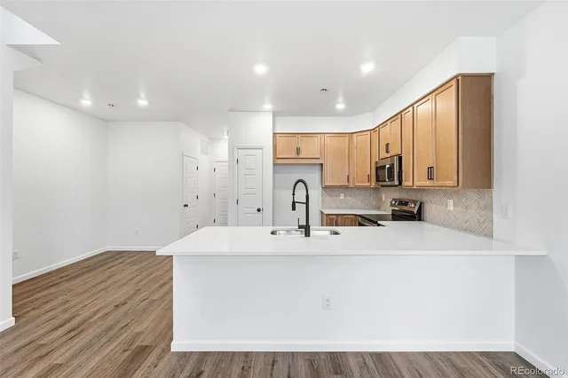 a kitchen with a sink and cabinets