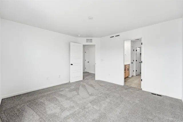 a bathroom with double sink and a mirror