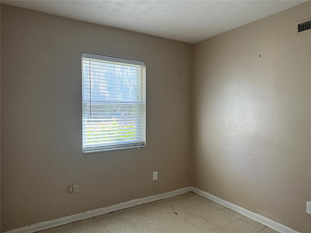 6315 Treehaven Drive Spring Hill, FL 34606 - Photo 13 of 21 an empty room with a window