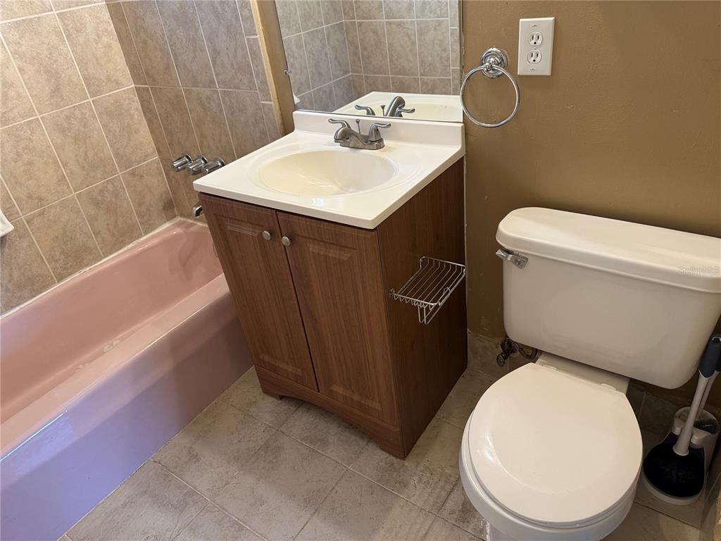 6315 Treehaven Drive Spring Hill, FL 34606 - Photo 17 of 21 a bathroom with a sink toilet and bathtub