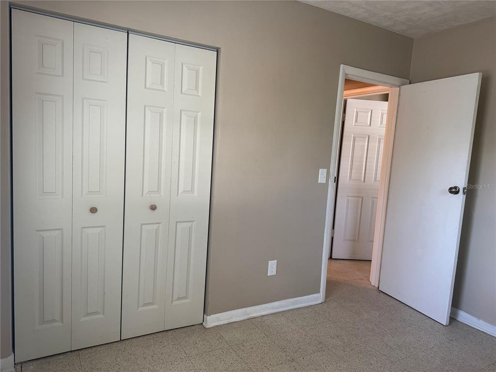 6315 Treehaven Drive Spring Hill, FL 34606 - Photo 21 of 21 an empty room with closet area