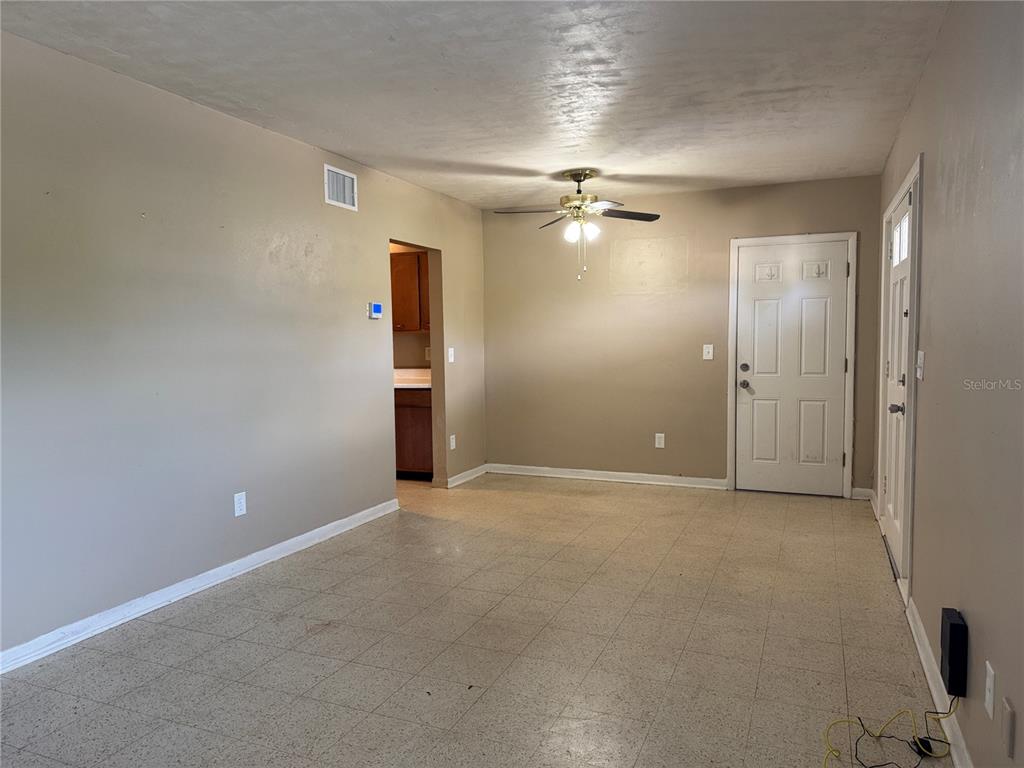 6315 Treehaven Drive Spring Hill, FL 34606 - Photo 9 of 21 an empty room with closet and a chandelier fan