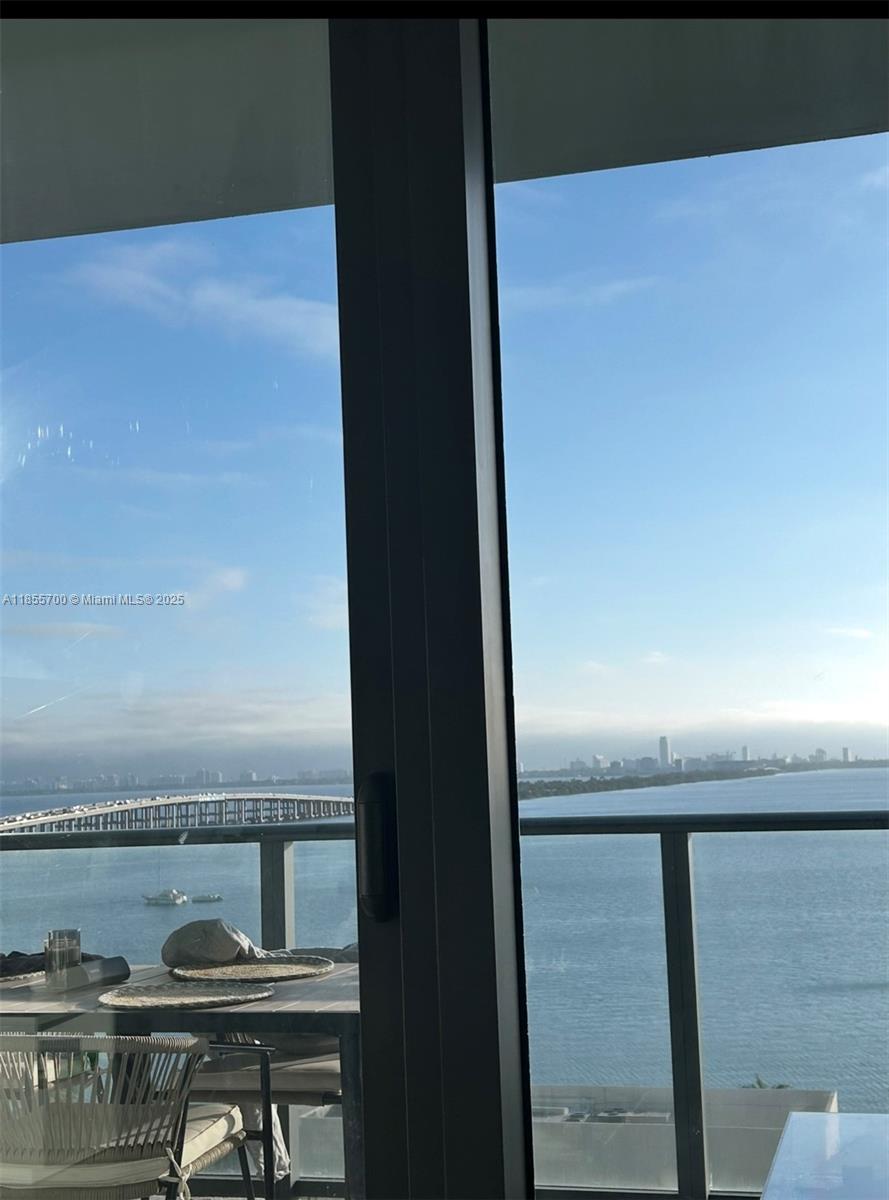 480 Northeast 31st Street, Unit 905 Miami, FL 33137 - Photo 1 of 15 a view of a lake from a balcony