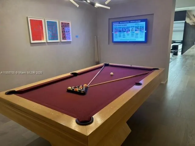 a room with furniture and air hockey table