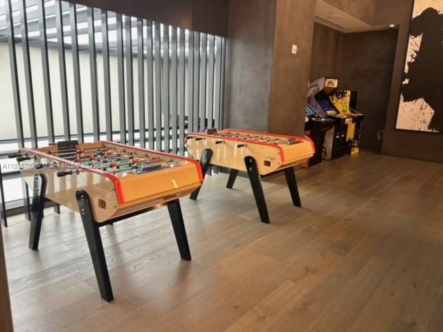 480 Northeast 31st Street, Unit 905 Miami, FL 33137 - Photo 14 of 15 a room with furniture and air hockey table