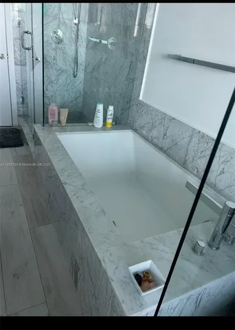 a view of balcony with wooden floor and outdoor seating