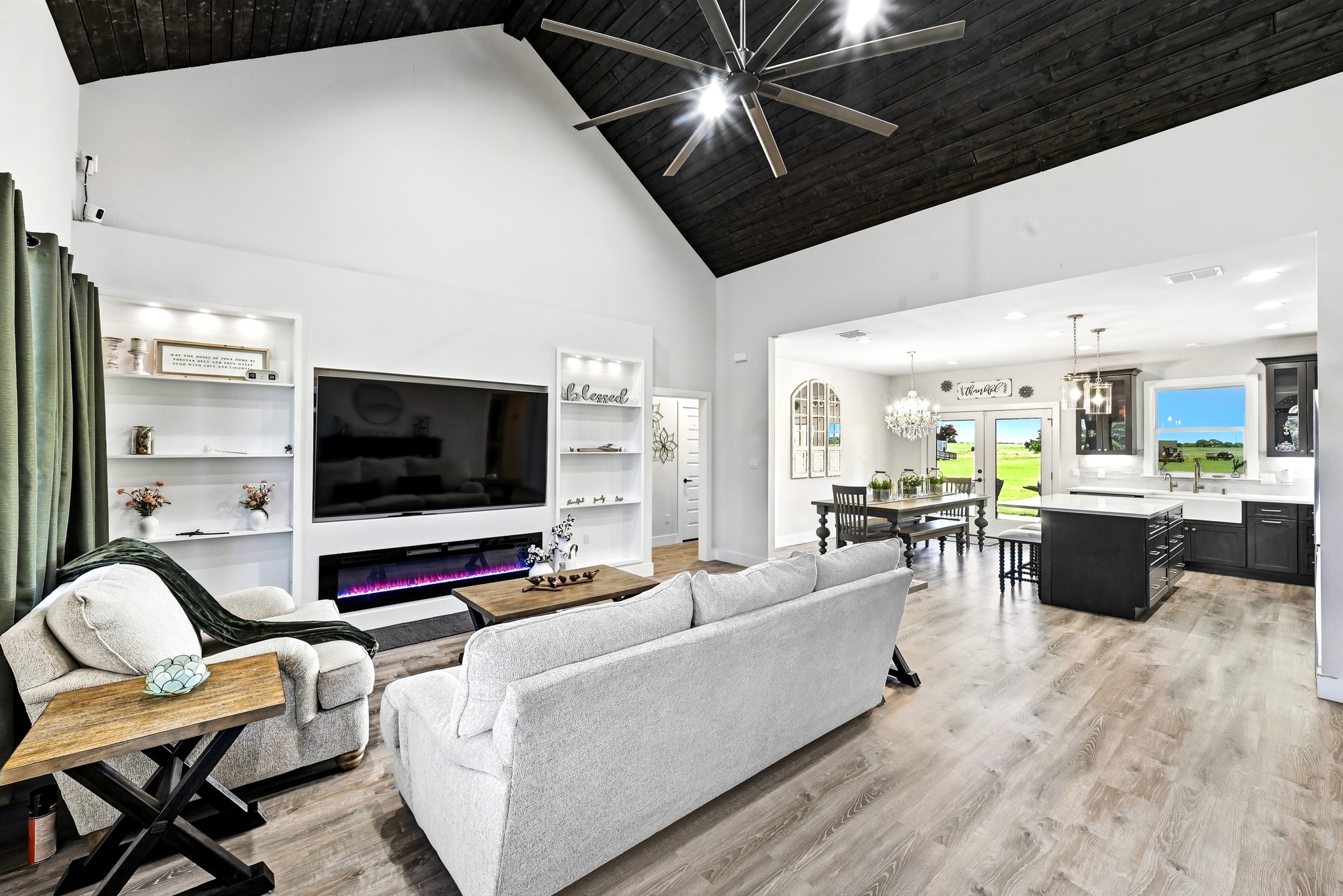 2889 Old McMahan Road Lockhart, TX 78644 - Photo 7 of 33 A striking vaulted ceiling with rich wood planking crowns this welcoming open-concept living space.