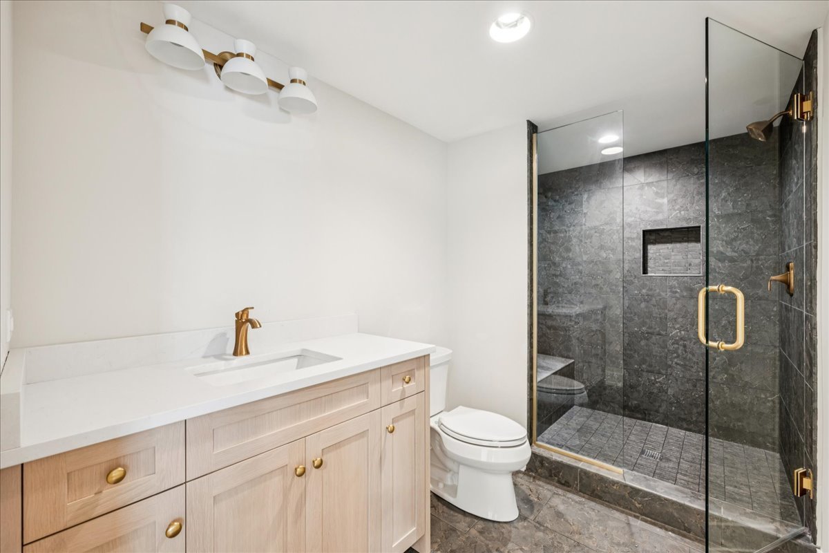 1068 Livingston (lot 1) Avenue Highland Park, IL 60035 - Photo 17 of 33 a bathroom with a sink a toilet and shower