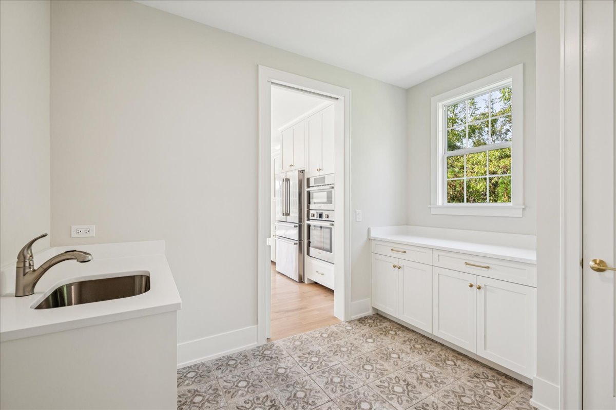 1068 Livingston (lot 1) Avenue Highland Park, IL 60035 - Photo 9 of 33 a view of a kitchen with a sink dishwasher and a window