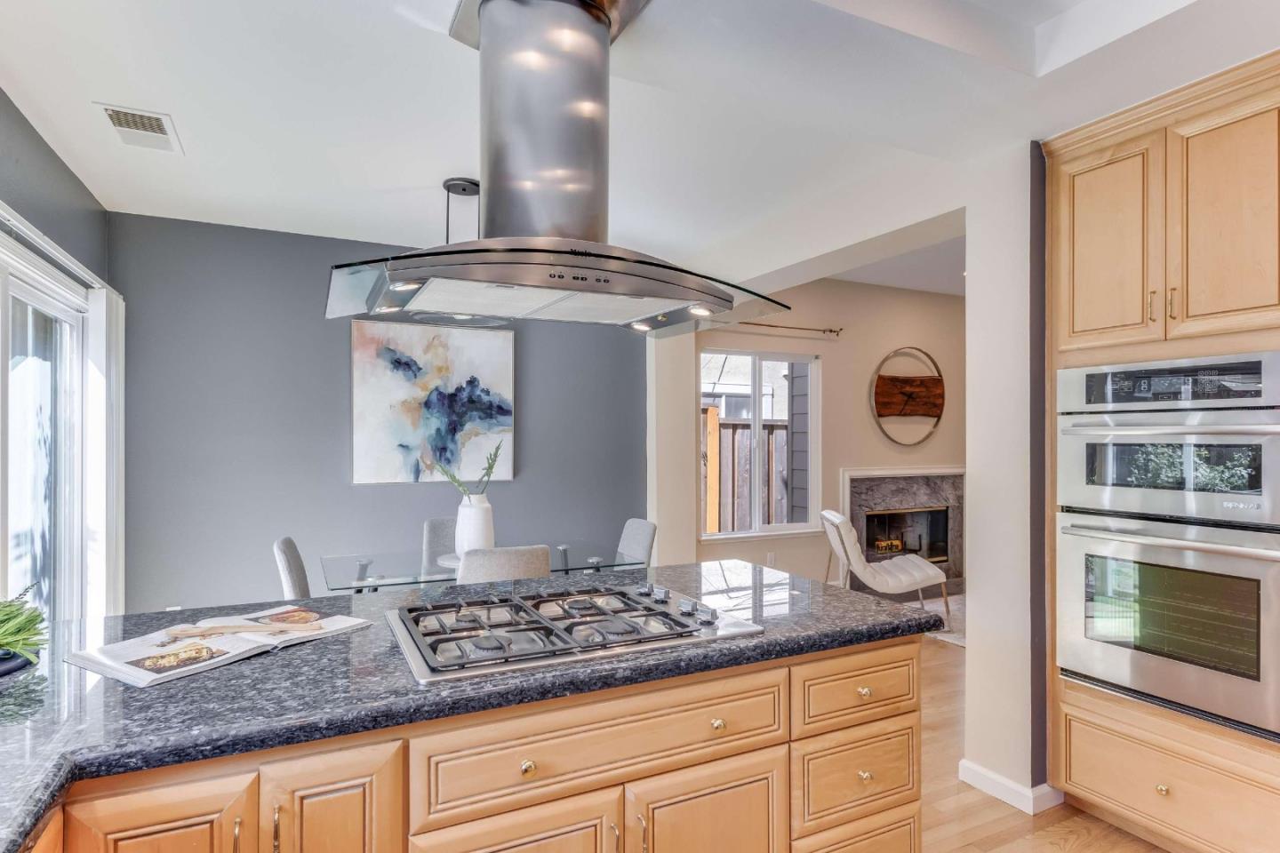 11627 Cedar Spring Court Cupertino, CA 95014 - Photo 11 of 54 a kitchen with stainless steel appliances granite countertop a stove and cabinets