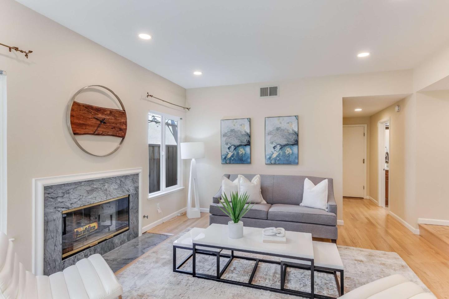11627 Cedar Spring Court Cupertino, CA 95014 - Photo 15 of 54 a living room with furniture a fireplace and a potted plant