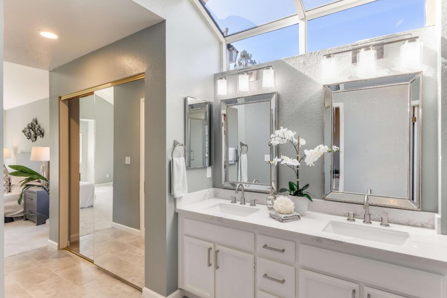 11627 Cedar Spring Court Cupertino, CA 95014 - Photo 20 of 54 a bathroom with a double vanity sink and a mirror