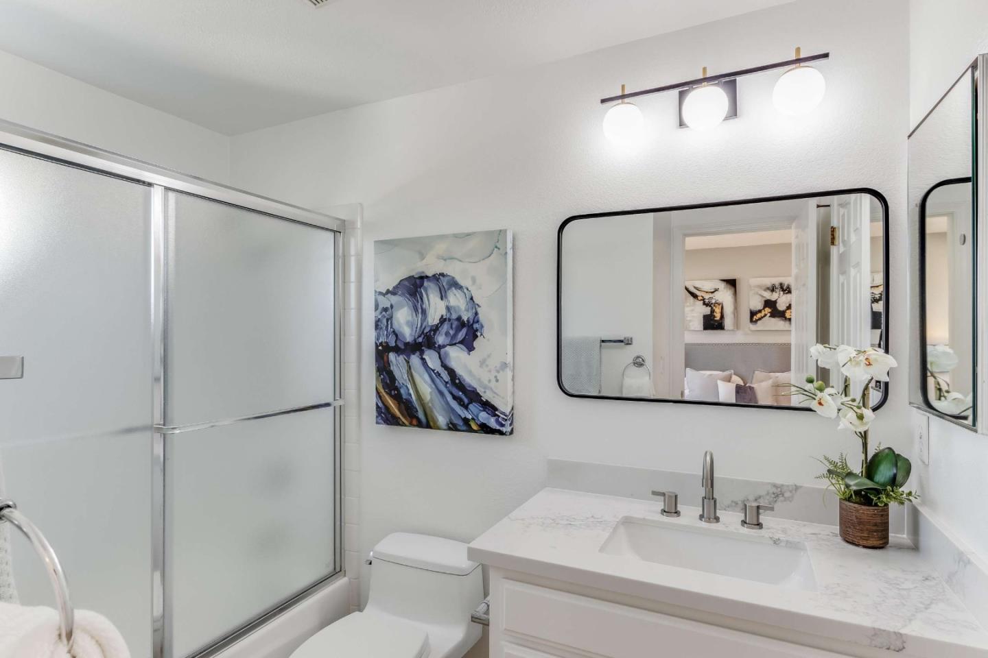 11627 Cedar Spring Court Cupertino, CA 95014 - Photo 24 of 54 a bathroom with a shower sink and toilet